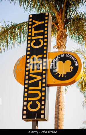 Sign for Culver City, California, 'The Heart of Screenland,' with a palm tree in the background Stock Photo