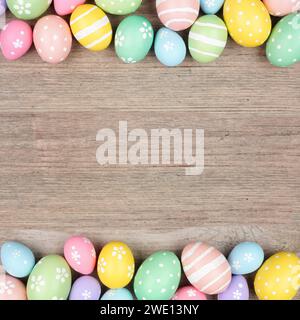 Colorful pastel Easter egg double border. Above view on a square, light wood background. Copy space. Stock Photo