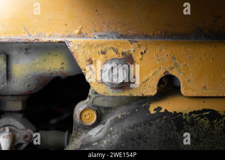 Close up look of an old power generator. Old yellow fuel back up generator. Stock Photo