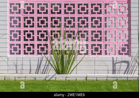 Retro breeze block wall with cactus plant in Palm Springs, California Stock Photo