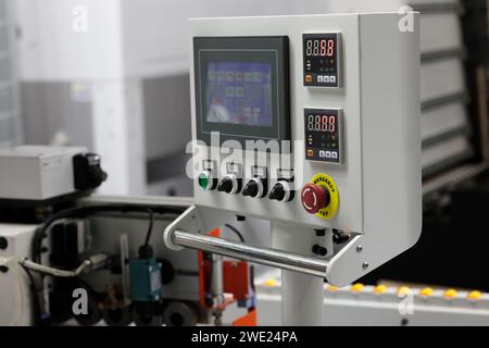 Control console of automatic edge banding machine. Selective focus. Stock Photo