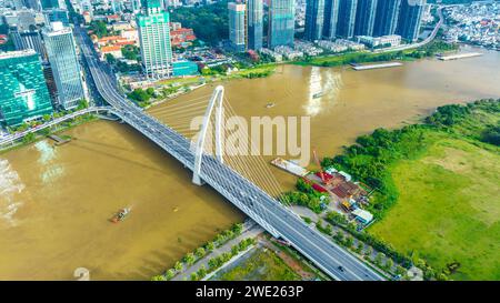 Aerial view of cable-stayed Ba Son bridge connecting traffic to commercial center across  Saigon River in Ho Chi Minh City, Vietnam Stock Photo