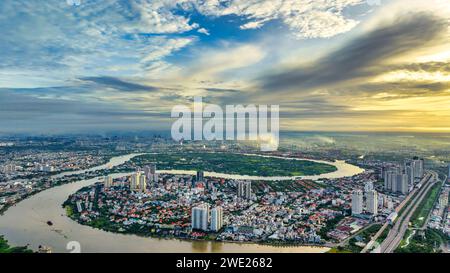 Top view aerial of a Ho Chi Minh City with development buildings, transportation, energy power infrastructure on a winter day. Cityscape on Saigon Stock Photo