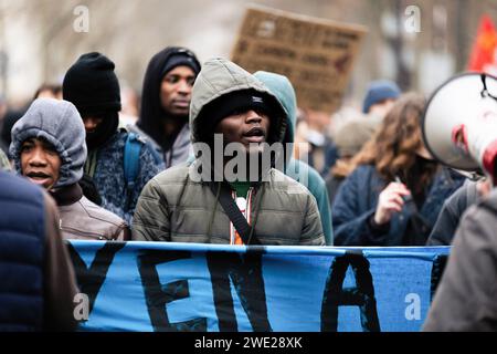 Paris, France. 21st Jan, 2024. An immigrant seen during the demonstration against the new immigration law. Several demonstrations against the new immigration law took place in several French cities. According to the organizers, 150,000 people mobilized across the country, a number well above the 75,000 declared by the authorities. In Paris, around 25,000 demonstrators protested between the Trocadero and the Invalides. Credit: SOPA Images Limited/Alamy Live News Stock Photo