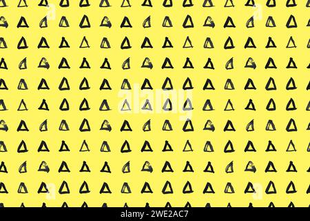 Dash pattern on yellow background. Wrapping paper with small black triangles painted with a brush. Seamless simple minimal ornament. Abstract Stock Vector