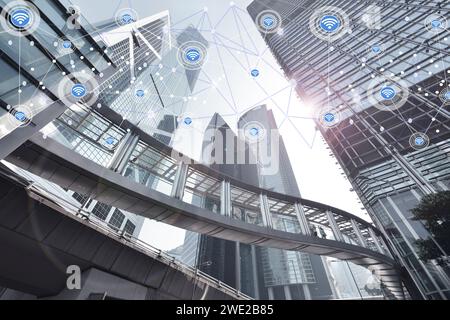 Smart city and wireless communication network on skyscrapers in central Hong Kong background,Financial modern technology concept. Stock Photo