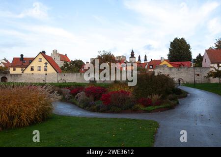 VISBY, SWEDEN ON OCTOBER 11, 2019. Almedalen Park on this side of the City Wall, and buildings. Unidentified person. Editorial use. Stock Photo