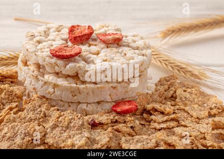 A close-up of a bowl filled with crunchy wheat flakes and an assortment of nutritious dried strawberries, making for a delicious and healthy breakfast Stock Photo