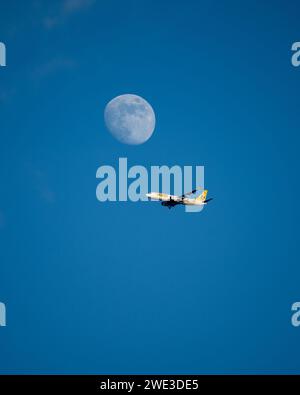 Buzz Boeing 737 MAX 8 aircraft and the moon Stock Photo