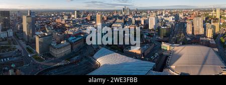 Wide panoramic aerial photograph of Manchester and Salford city centres, UK, taken from Manchester Arena looking south on a beautiful sunny morning Stock Photo