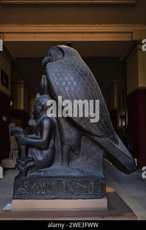 Cairo, Egypt - January 2, 2024: Statue of young Ramses II and God Horus at The Egyptian Museum Stock Photo