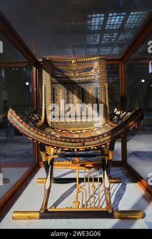 Cairo, Egypt - January 2, 2024: Ceremonial Chair of Tutankhamun in Museum of Egyptian Antiquities (known commonly as the Egyptian Museum Stock Photo
