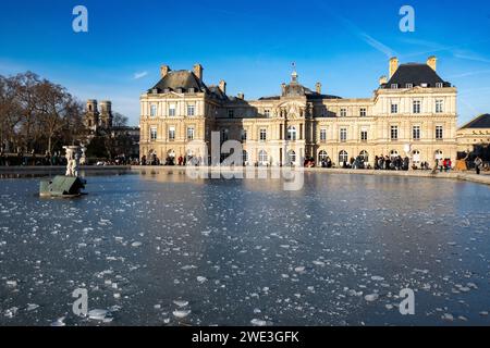 Paris, France, Icy lake and Palais du Luxembourg in  Jardin du Luxembourg (Luxembourg garden) of Paris, Editorial only. Stock Photo