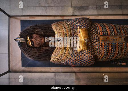Cairo, Egypt - January 2, 2024: Close shot of a gold Akhenaten's coffin lid from the 18th dynasty at the Egyptian Museum Stock Photo