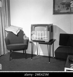 Television set in the 1950s. An early television set in period design wooden cabinett with only the ability to display television broadcasts in black and white.  The knobs on the front control the picture and sound. 1956 Svahn ref SVA1 Stock Photo