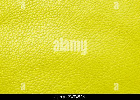 Macro shot yellow leather texture background.. Part of perforated leather details. Yellow perforated leather texture background. Texture, artificial l Stock Photo