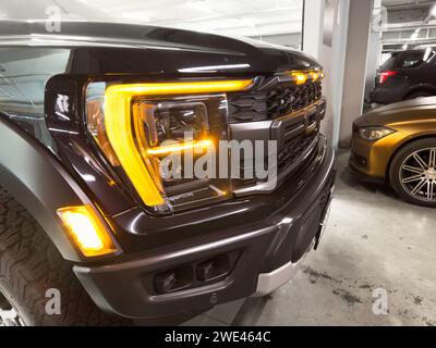 Yerevan, Armenia, August 18, 2023: Ford F-150 Raptor radiator grill and bumper with logo Ford close up. F-series ford pickup truck. Ford F-150 Raptor Stock Photo