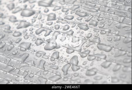 Water drops texture background. Shiny water drops on aluminium surface. Stock Photo