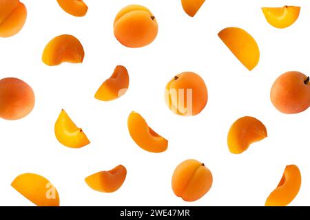 Falling apricots isolated on white. Background of apricot fruit. Sweet apricots isolated on white background cutout. Stock Photo