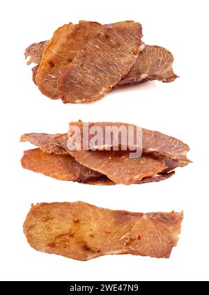 Pieces of cured pork isolated on white background. Portion of dried pork on white background. Dried pork isolated on white background. Pieces of dry m Stock Photo