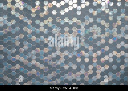 Pattern of blue rhomb tiles on wall close up view Stock Photo