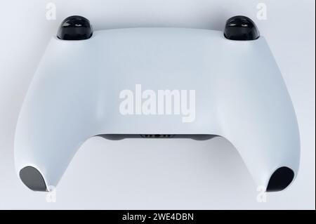 Back view of modern game joystick isolated on studio background Stock Photo