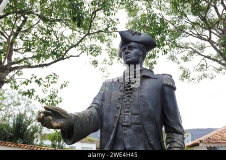 Tiradentes, Minas Gerais, Brazil - October 07, 2023: Tiradentes metal statue representing the young ensign on a public road Stock Photo