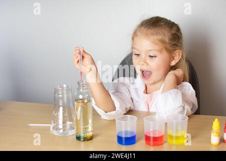 Little girl doing science experiment. Kindergarten. Education concept Stock Photo