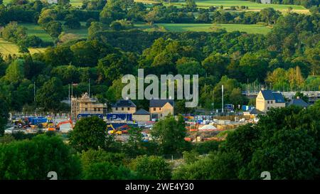 Building constructing houses in scenic rural valley (newly built, loss of green field land & fields) - Burley-in-Wharfedale, West Yorkshire England UK Stock Photo