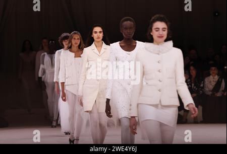 Paris, France. 23rd Jan, 2024. Models present creations from the haute-couture spring/summer 2024 collections by French fashion house Chanel during the Paris Fashion Week, in Paris, France, on Jan. 23, 2024. Credit: Gao Jing/Xinhua/Alamy Live News Stock Photo