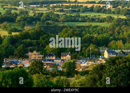 Building constructing houses in scenic rural valley (newly built, loss of green field land & fields) - Burley-in-Wharfedale, West Yorkshire England UK Stock Photo