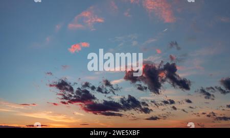 Beautiful dramatic sky with clouds at sunset. Evening sky with pink clouds Stock Photo