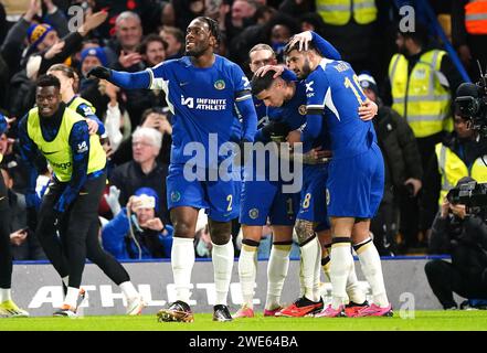 Chelsea's Enzo Fernandez (centre) celebrates scoring their side's second goal of the game with team-mates during the Carabao Cup semi final second leg match at Stamford Stadium, London. Picture date: Tuesday January 23, 2024. Stock Photo