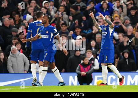 Chelsea's Enzo Fernandez (right) celebrates scoring their side's second goal of the game with team-mates during the Carabao Cup semi final second leg match at Stamford Stadium, London. Picture date: Tuesday January 23, 2024. Stock Photo