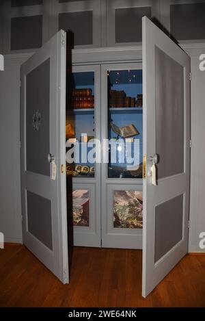Amsterdam, Netherlands. January 20, 2024. An old cabinet of books in the Luther house in Amsterdam. High quality photo Stock Photo