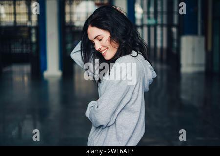 Smiling young woman with eyes closed Stock Photo