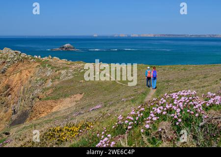 France, Brittany, Man and woman hiking at Cap de la Chevre Stock Photo
