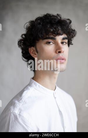 Man wearing shirt against gray background Stock Photo