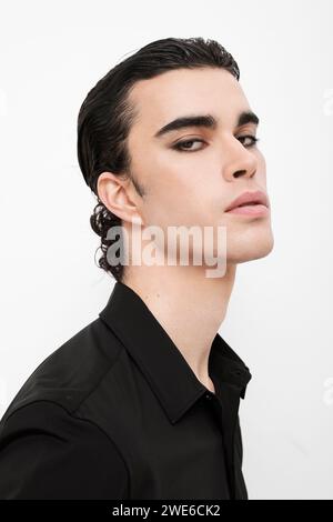 Fashionable man in black shirt against white background Stock Photo