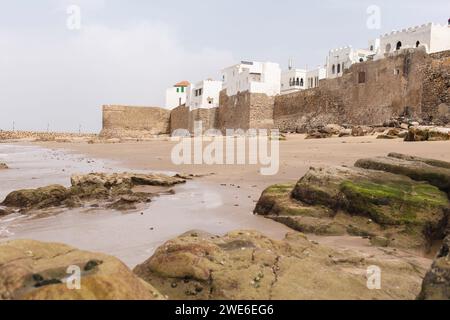 Beach near sea walls of Asilah, Morocco, Africa Stock Photo