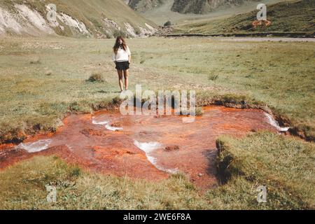 Woman standing near Abano lake in Truso valley. Georgia Stock Photo