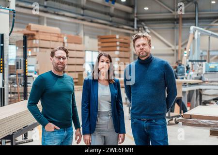 Confident architects standing in industry Stock Photo