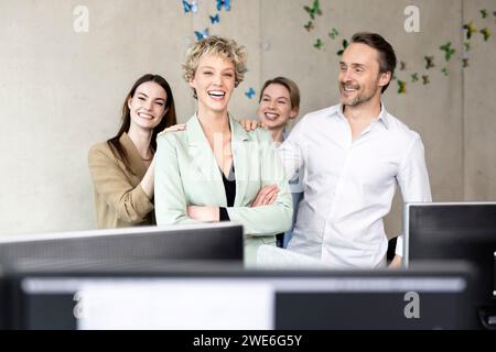 Cheerful business colleagues standing in office Stock Photo