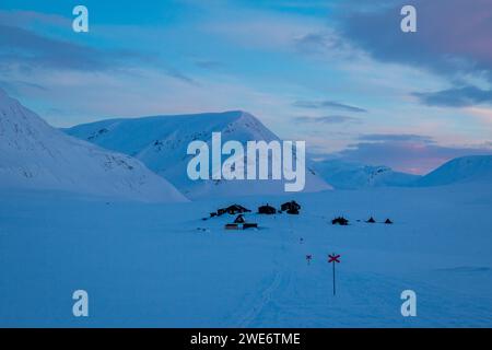 Salka Mountain Huts on Kungsleden skiing train in winter, Lapland, Sweden Stock Photo