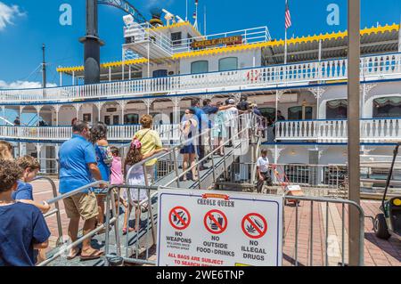 Passengers boarding the Creole Queen steam powered paddlewheel riverboat for a cruise on the Mississippi River Stock Photo