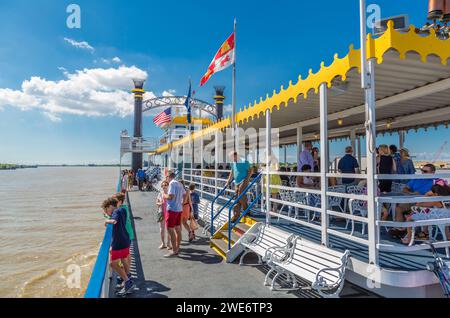 Passengers of the historic Creole Queen paddlewheel riverboat enjoying a cruise on the Mississippi River ar New Orleans Stock Photo