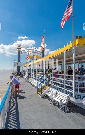 Passengers of the historic Creole Queen paddlewheel riverboat enjoying a cruise on the Mississippi River ar New Orleans Stock Photo