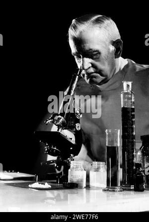 Scientist with microscope Stock Photo