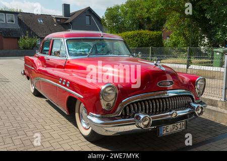 A shiny red vintage Buick car parked in front of a house, classic car, Buick Eight, Ilsede, Peine district, Lower Saxony, Germany Stock Photo