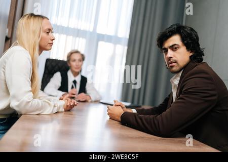 Frustrated woman talking to mature female psychologist during consultation session. Disappointed in marriage wife complaining on husband looking at Stock Photo